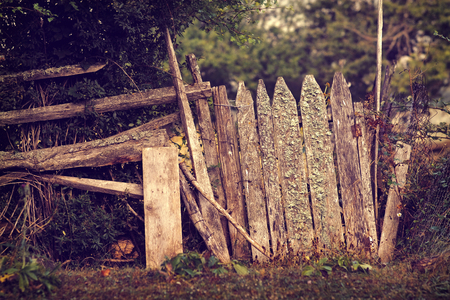 Old wooden vintage fence in the garden, soft focusの写真素材