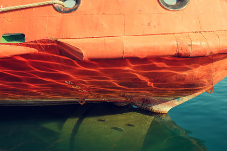 Reflection on the keel of old orange ship