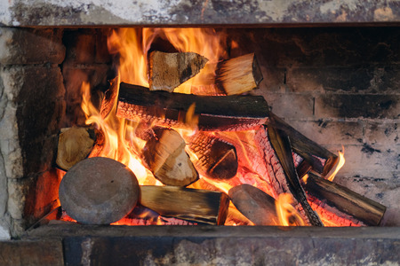 Burning clay pans in a fireplace