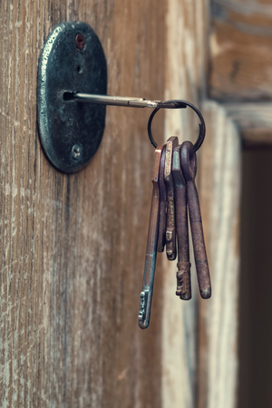 Set of old grunge keys in the keyhole, selective focusの写真素材