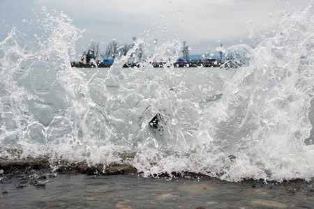 Splashing waves at the sea portの写真素材