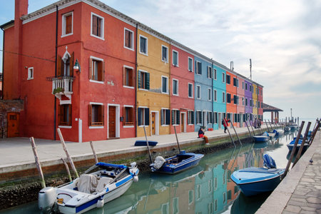 Venice landmark, Burano island canal, colorful houses and cloudy skyのeditorial素材