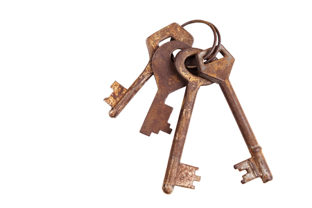 Old rusty keys isolated on a white backgroundの写真素材