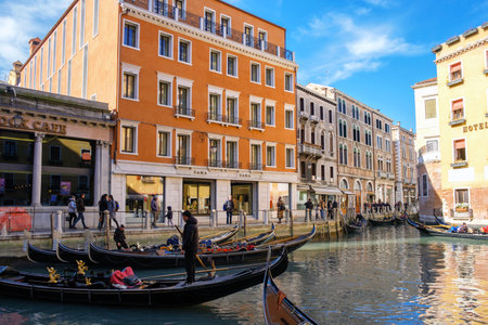 Venice, Italy, February 25, 2019: Gondolas at the pierのeditorial素材