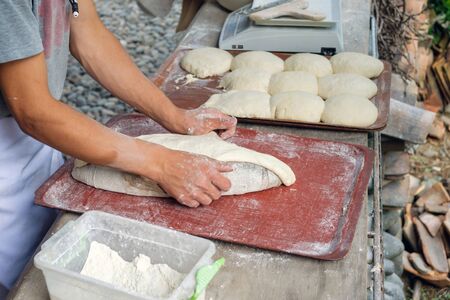 Baker making dough for traditional Georgian bread