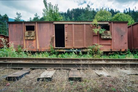 Old vintage abandoned wooden cargo train carriage