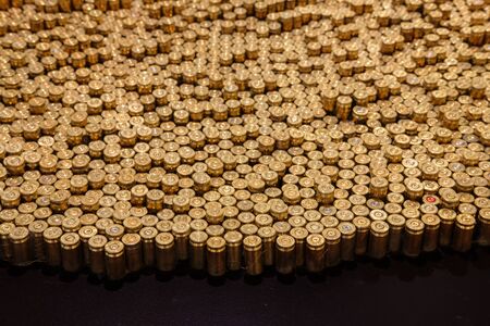 Rows of the shiny bullets with  selective focus point
