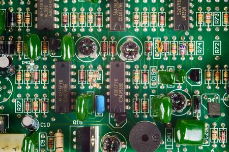 Green electronic circuit board background, close up