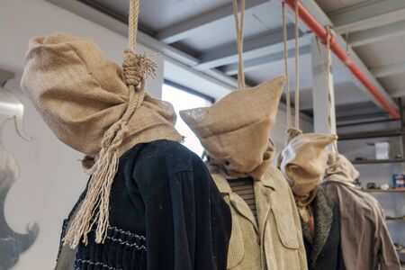 Prop bodies of a hanged men with sack on a head, selective focusの写真素材