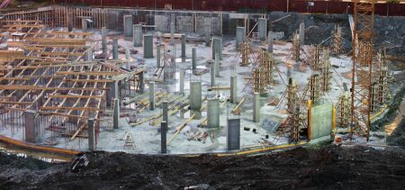 Empty illuminated construction site at night