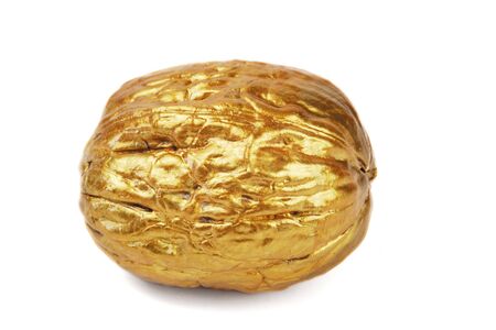 Single golden walnuts on a white backgroundの写真素材