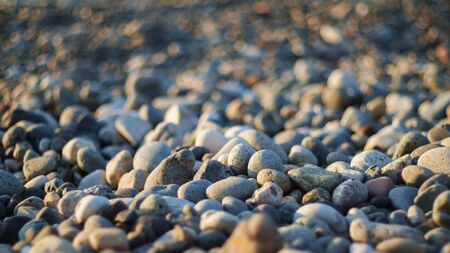 Background with pebble stones close up, selective focus