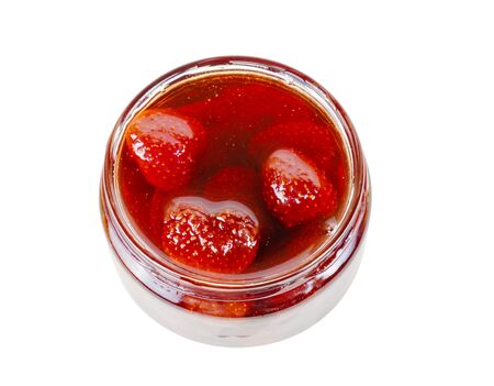 Strawberry jam in a glass jar isolated on a white backgroundの写真素材