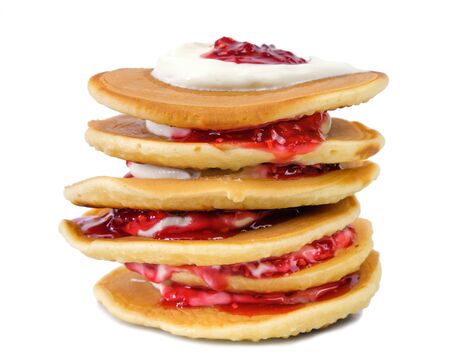 Stack of pancakes with sour cream and raspberry jam isolated on white backgroundの写真素材