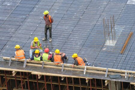 Group of workers at construction site during a break
