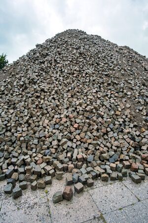 Large pile of color natural stone cubes for making outdoor pavement tiles