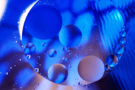 Abstract background with gradient of a blue and white colors, oil drops in water abstract bubbles...