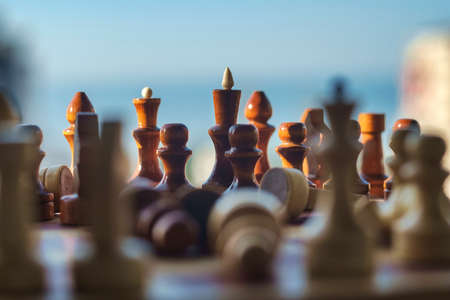 Wooden chess pieces on the chessboard, selective focusの写真素材