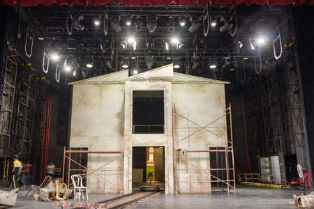 Theater decoration of a house facade with requisites, props and equipment on the stage