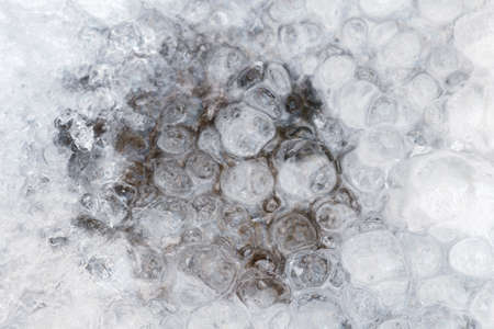 Winter background of a frozen water