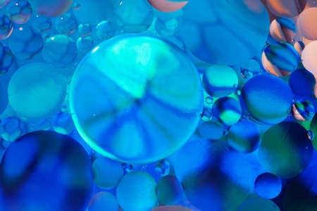 Abstract background with gradient of a blue colors, oil drops in water abstract bubbles backgroの写真素材