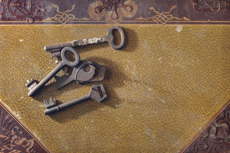 Old rusty keys on the aged vintage book