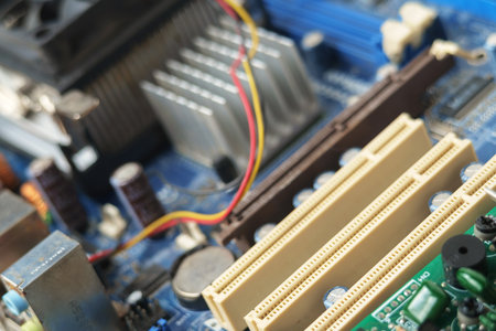 A blue electronic circuit board background, close up