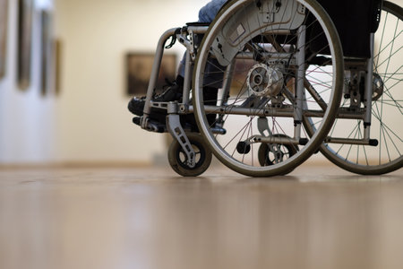 View of a detail of wheelchair visiting the art gallery, selective focusの写真素材