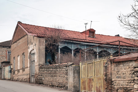 View of the old house and stone fence