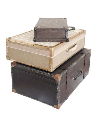Stack of a vintage leather various color suitcases isolated on white backgroundの写真素材