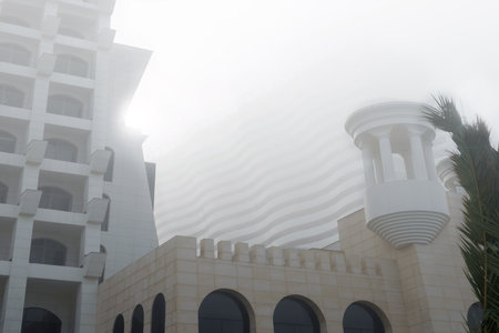 Low angle view of a modern architecture details during foggy and misty weatherの写真素材