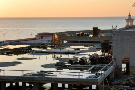 Puddles on the top of construction site on the coastの写真素材
