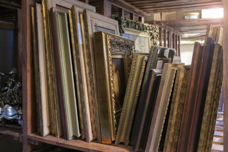 Batumi, Georgia, March, 15, 2016: Batumi Art Museum storage, Wooden shelves full of pictures and framesのeditorial素材