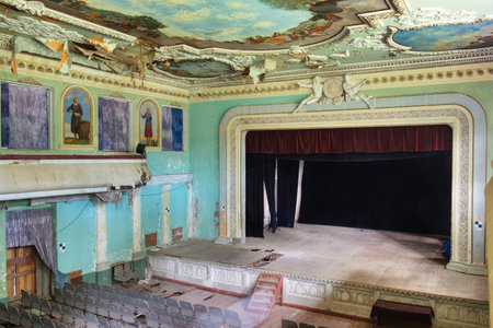 Abandoned and ruined theater stage with paintingsの写真素材