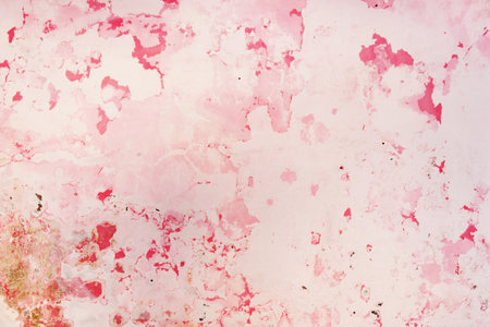 Peeling paint on the wall. Weathered rough painted surface with patterns of cracksの写真素材