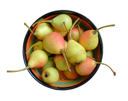 Ripe pears in a ceramic bowl, isolated on a white backgroundの写真素材