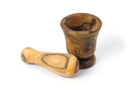 Wooden mortar and pestle isolated on white backgroundの写真素材