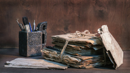 Stack of old papers and books tied with rope, selective focusの写真素材