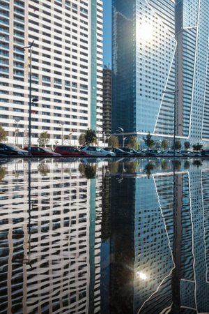 Skyscrapers reflecting on the waterの写真素材