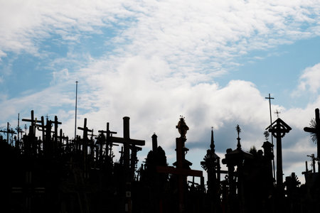 View of crosses silhouettes on the blue cloudy sky background