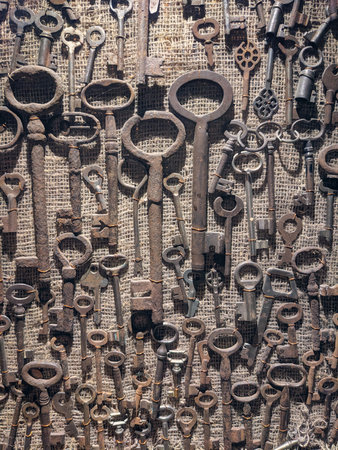 Rusty old keys on canvas backgroundの写真素材