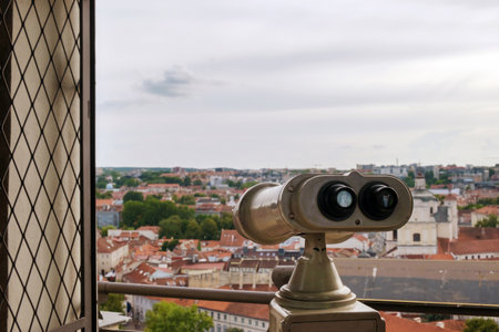 Coin operated binocular viewer on blurred background of city, selective focusの写真素材