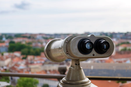 Coin operated binocular viewer on blurred background of city, selective focusの写真素材