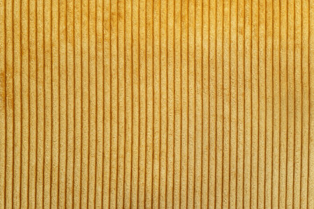 Yellow corduroy fabrick background. close upの写真素材