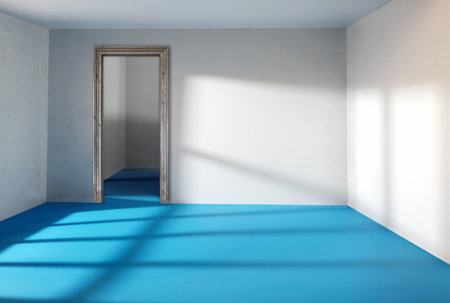 Sunlight from the window shines on the empty room walls and floorの写真素材