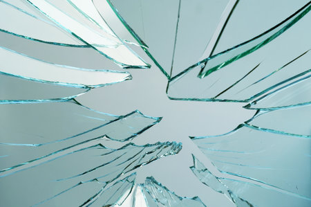 Cracked and broken glass with hole