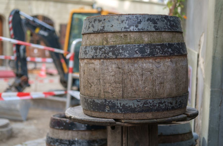 Old wooden whiskey barrels on the street, selective focus