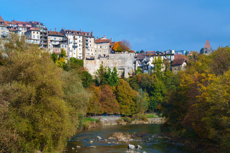 View of old swiss city Fribourg on river saane os sarine at autumnの写真素材