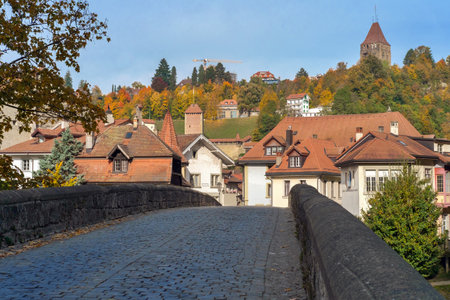 View of the Swiss town of Fribourg old bridge and historical houses