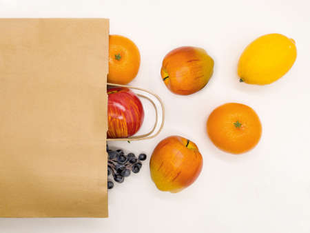 A paper bag with fruit. Food delivery. An ecological product. Advertising.の写真素材
